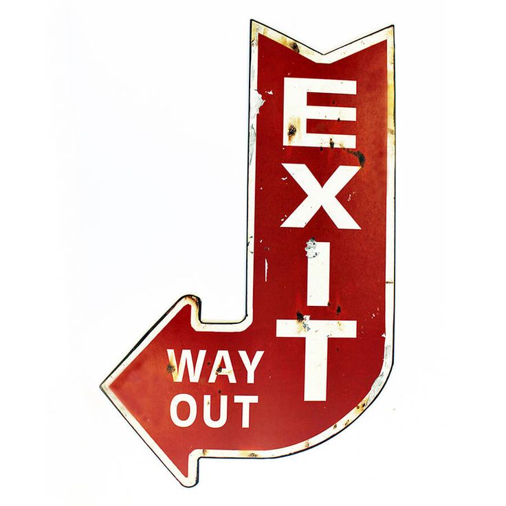 a red sign that says exit way out with an arrow pointing in the opposite direction