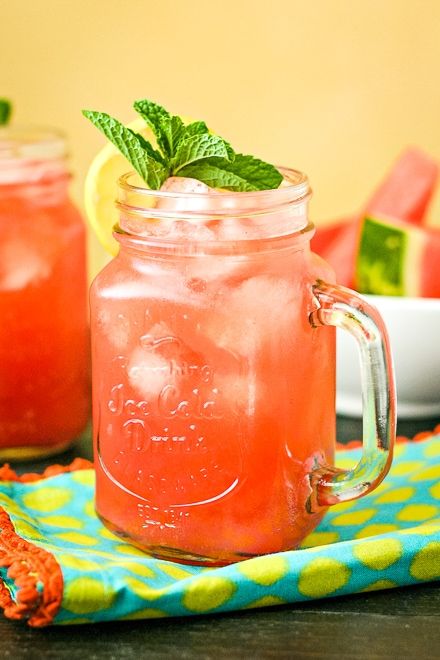 two mason jars filled with watermelon and mint