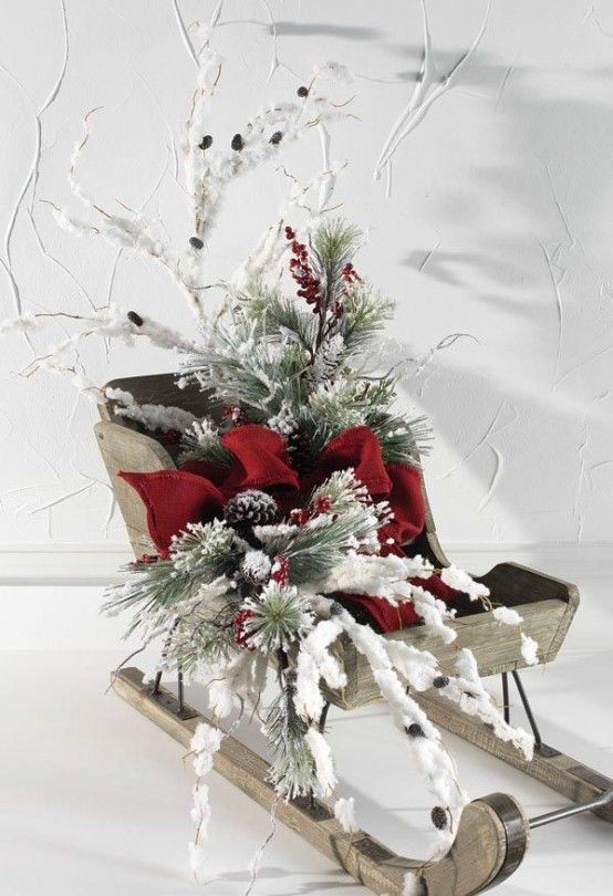 a sled filled with lots of white and red decorations