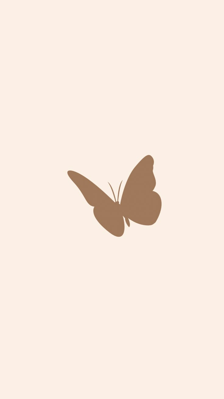 a brown butterfly flying through the air