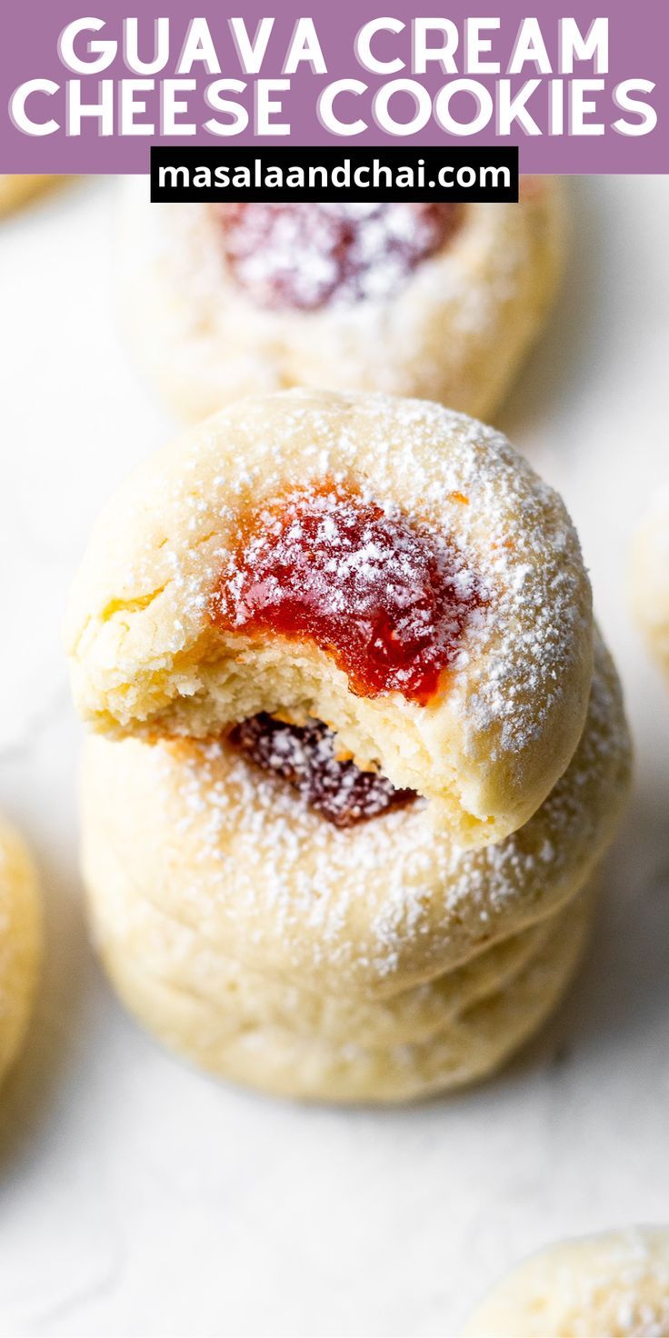 some sugary cookies with jam on them and the words guava cream cheese cookies