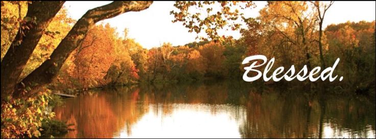 a lake surrounded by trees with the words blessing written in white on it's side