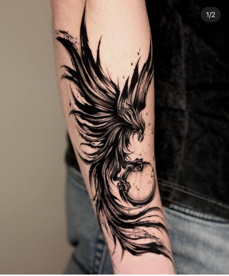 a black and white tattoo on the arm of a man with a bird in his hand