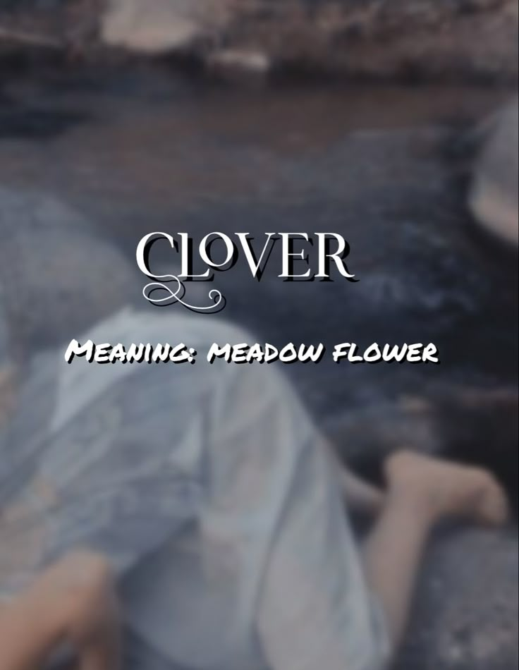 a woman laying on top of a rock next to a river with the words clovr meaning meadow flower