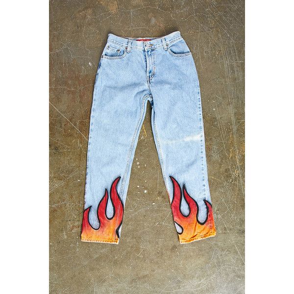 a pair of jeans with flames painted on them