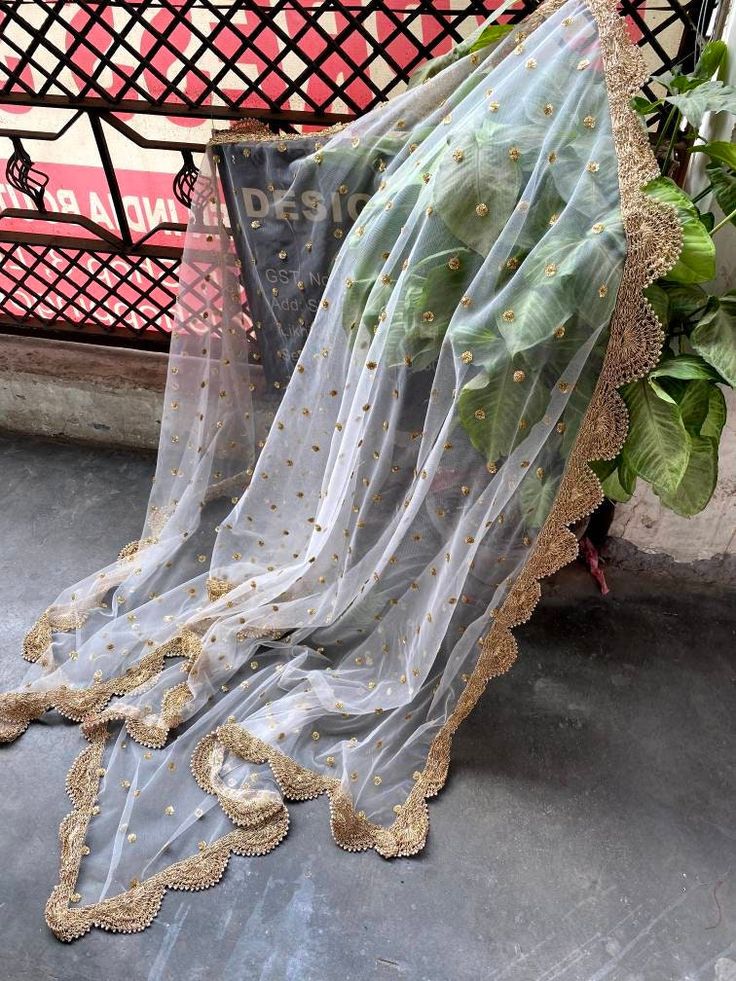 This is a Dupatta made on orders. It is made using net fabric with gold Sequinces embroidery all over. We stitch a beautiful golden lace to all sides of it and decorate with tassels. Dupatta is having a length of 100 inches and width of around 40 inches. I don't keep it readymade I only make it exclusively for my customers. Can be fully customised. Partywear Dresses Indian, Tassels Dupatta, Golden Dupatta, Lehenga For Women, Arabic Henna, Lehenga Suit, Golden Lace, Partywear Dresses, Lavender Blouse