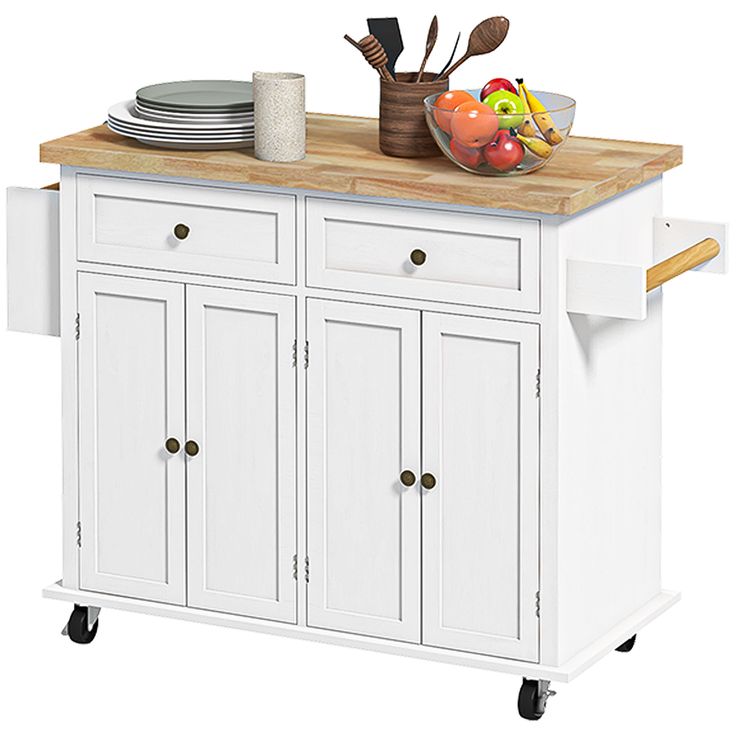 a white kitchen island with wooden top and drawers on casteor wheels, in front of a bowl of fruit