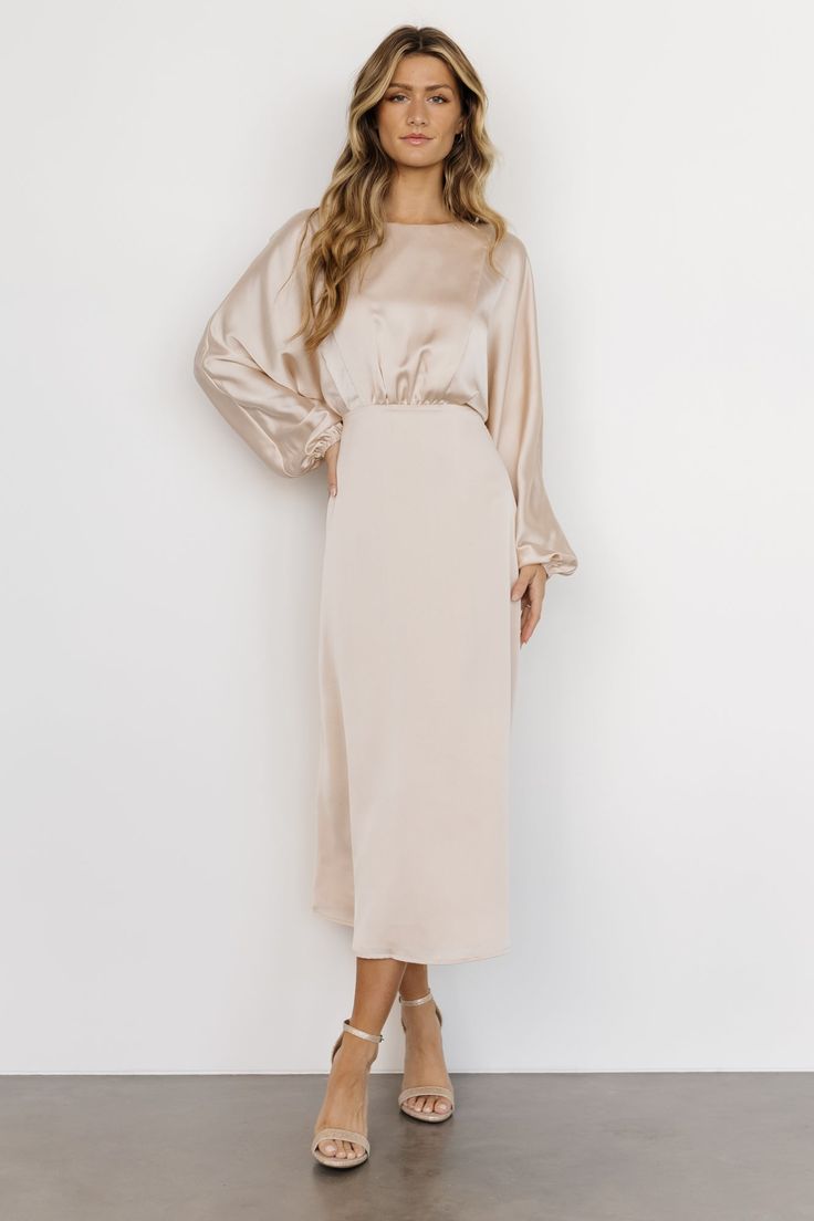 Balta Satin Midi Dress | Champagne | Baltic Born Cream Dress With Sleeves, Beige Dress Long Sleeve, Long Sleeve Champagne Bridesmaid Dress, Modest Cream Bridesmaid Dresses, Champagne Rehearsal Dinner Dress, Winter Engagement Photo Dress, Mid Length Mother Of The Bride Dresses, Timeless Business Casual, Modest Champagne Bridesmaid Dresses