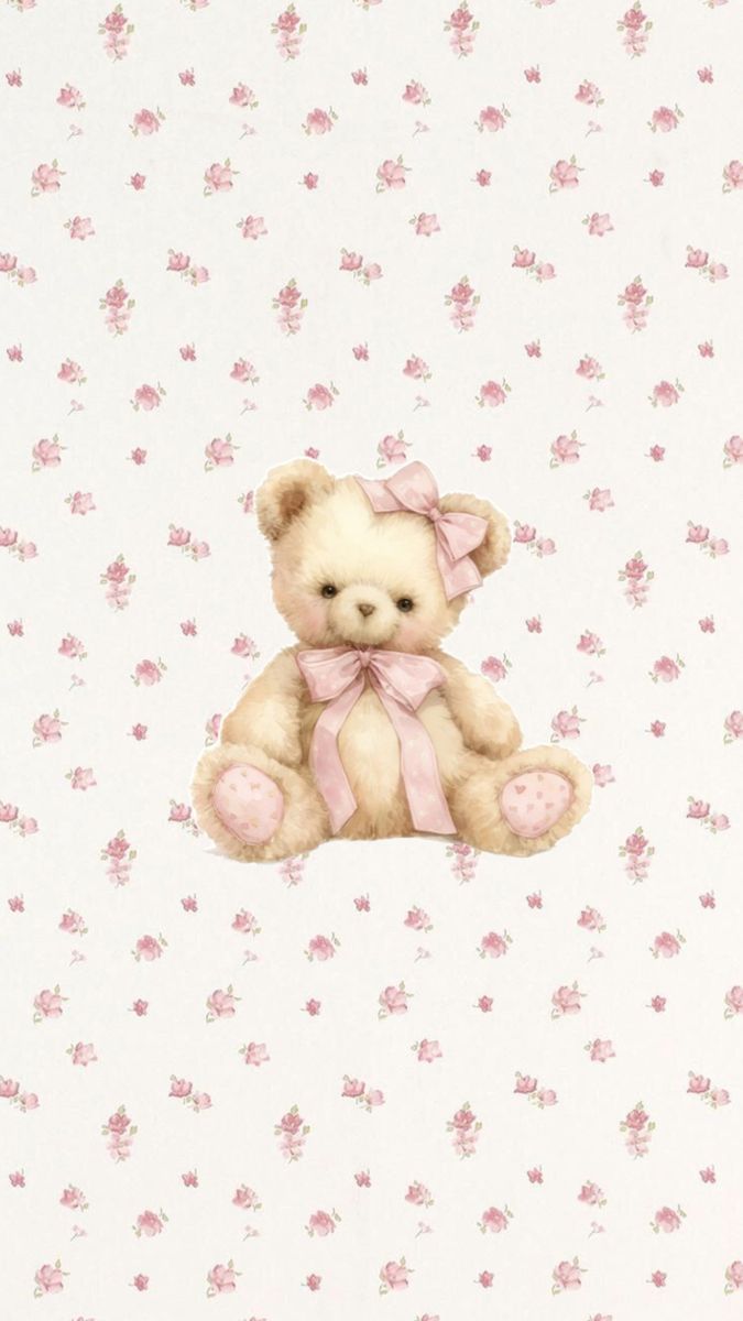 a brown teddy bear sitting on top of a pink flowered wallpaper covered in white and pink flowers