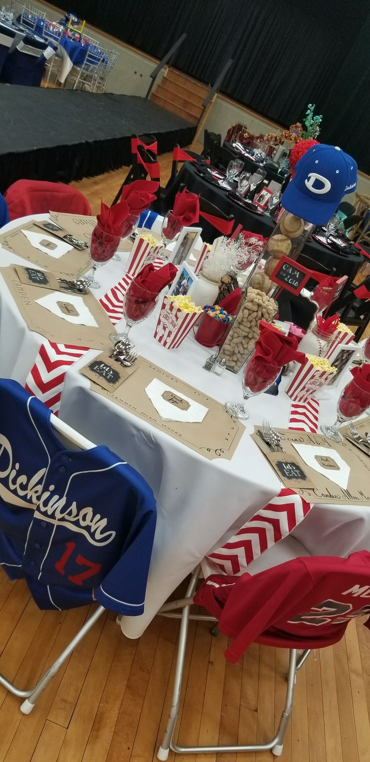 the table is set up for an event with red, white and blue decorations on it