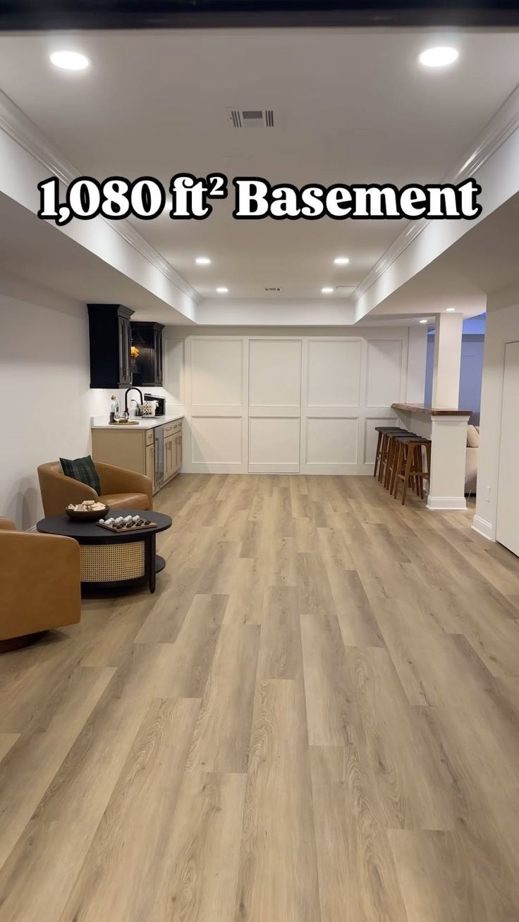 an empty room with wood floors and white walls, has the words 1080ft basement on it