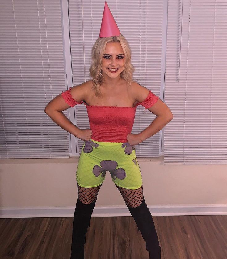 a woman is dressed up as a cartoon character with her hands on her hips, posing for the camera