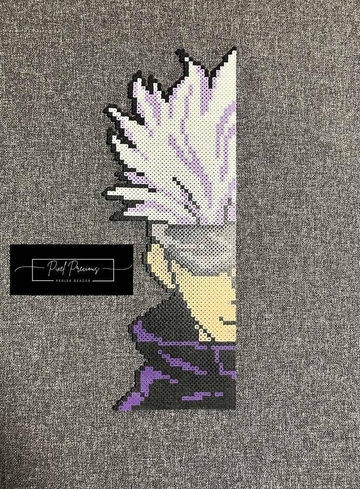 a cross - stitch pattern of a man's head with white hair and purple eyes