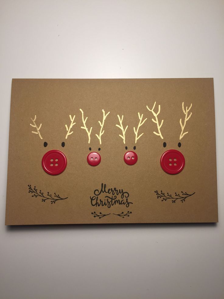 three red buttons are attached to the side of a card with reindeer antlers on it