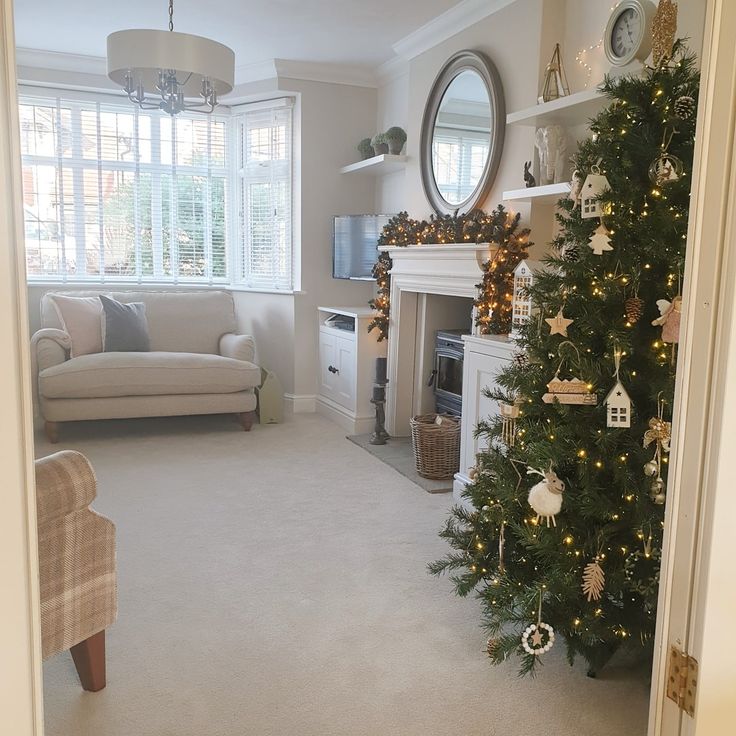 a living room with a christmas tree in the corner