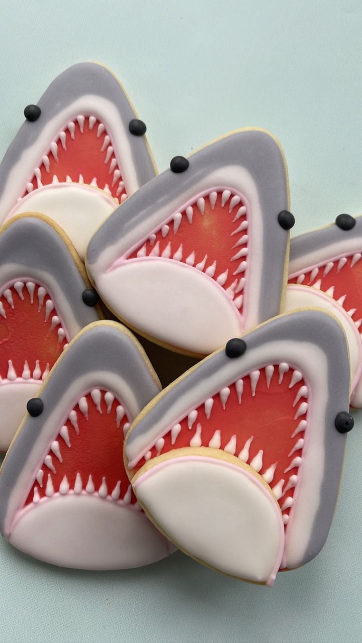 decorated cookies with shark teeth on them