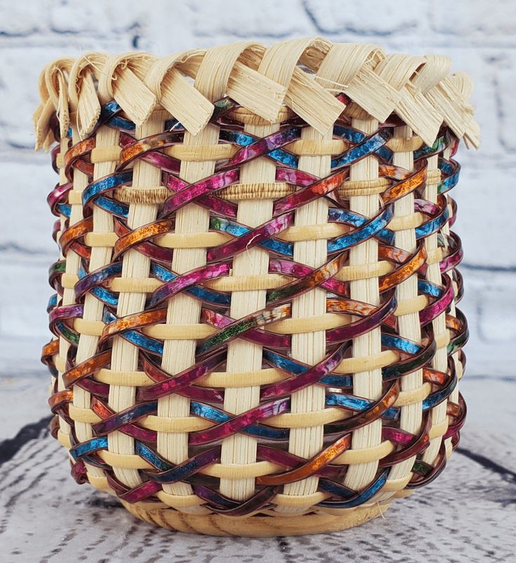 a woven basket sitting on top of a wooden table