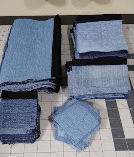 several pieces of blue cloth laid out on a table