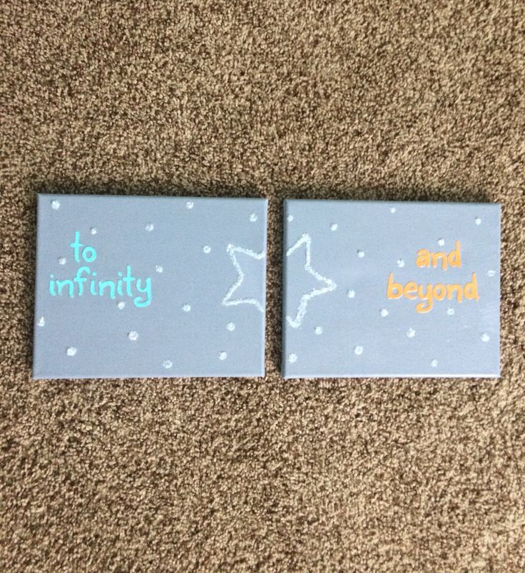 two magnets that say to infinity and beyond on carpeted area next to each other