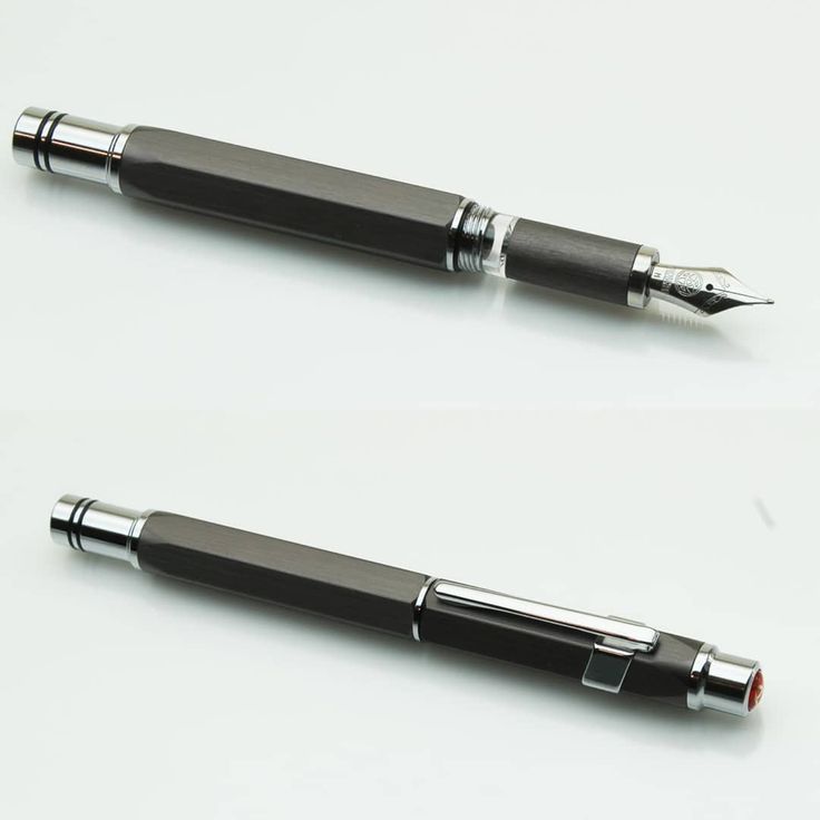 two pens sitting next to each other on top of a table