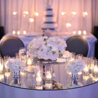 a table with candles and flowers on it