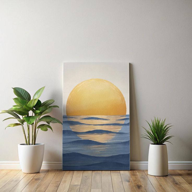 two potted plants sit on the floor next to a painting that looks like an ocean sunset