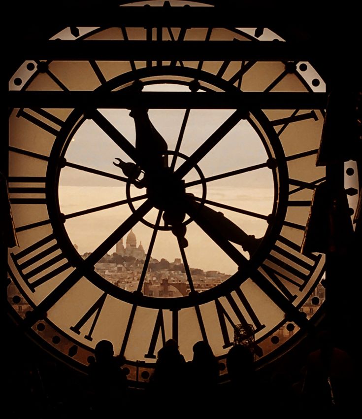 a large clock with roman numerals in the middle of it's face