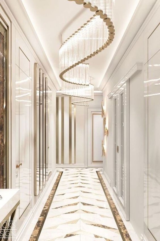 an elegant hallway with chandelier and marble flooring is shown in this rendering