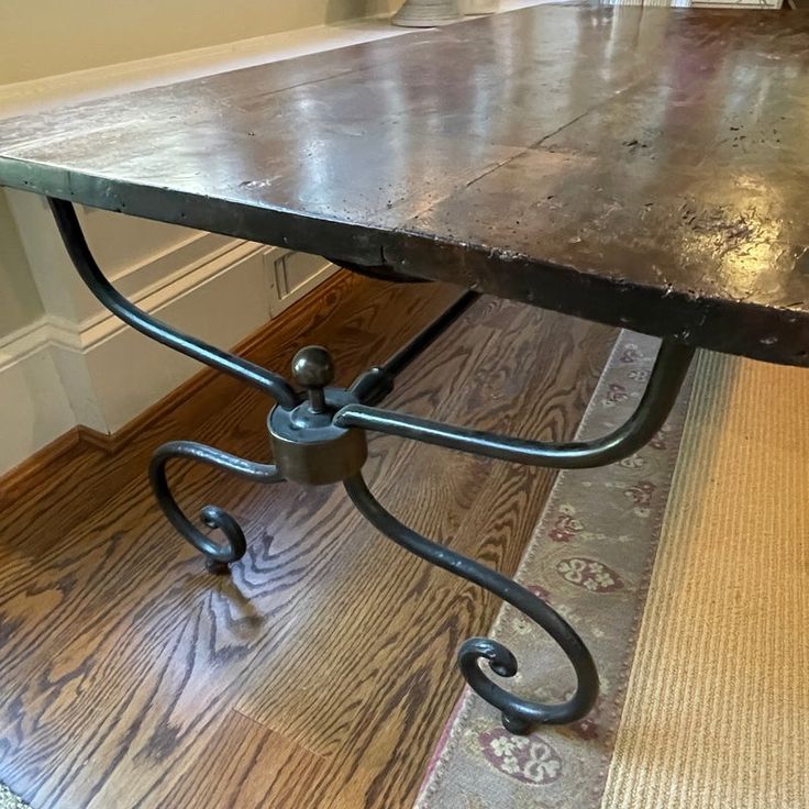 an old table is sitting on the floor