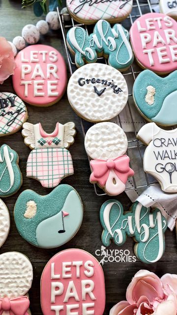 decorated cookies are displayed on a table