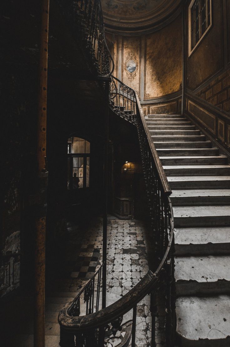 an old set of stairs leading up to the second floor