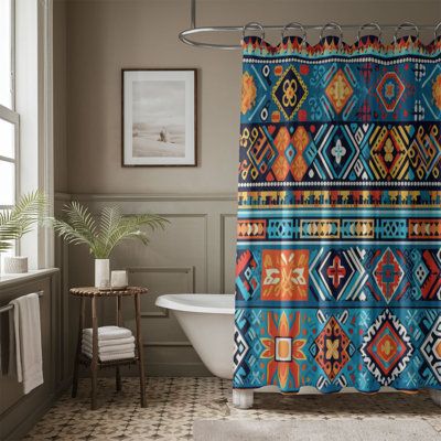 a bathroom with a bathtub, shower curtain and rug in the shape of an ethnic pattern