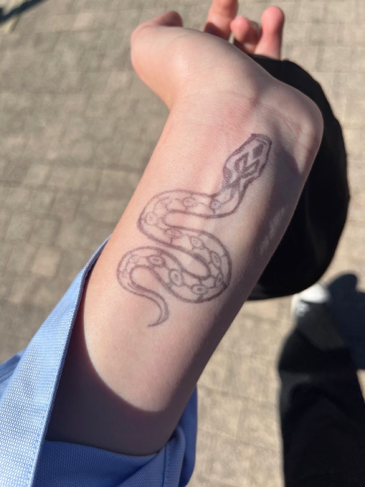 a person with a tattoo on their arm