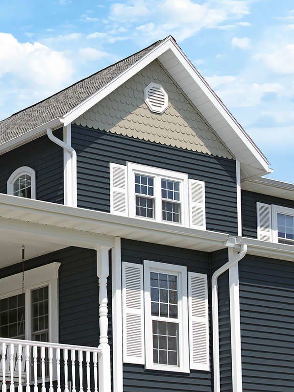 a blue house with white trim and windows