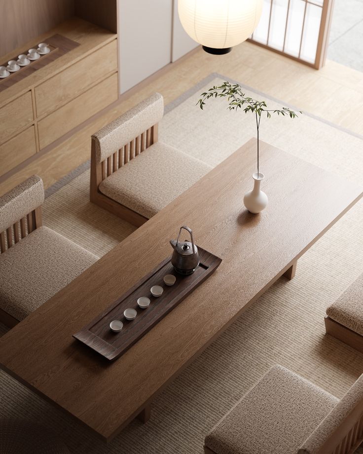 an overhead view of a dining room table with benches and a vase on the table