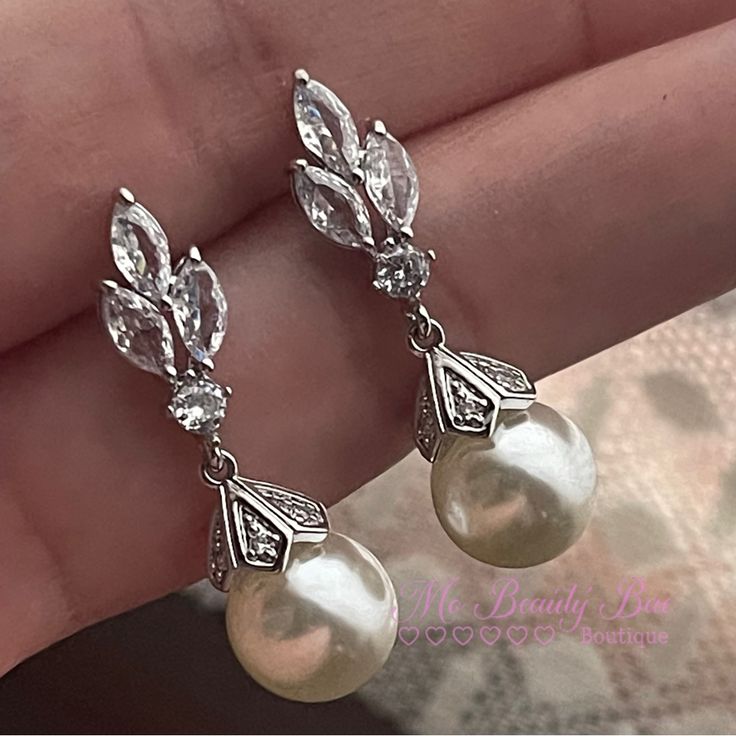 Crystal Pearl Drop Earrings Light Weight Dainty Cute Wedding Earrings. You Wont Even Notice You Have These On. A Classic Simple Take For An Elegant Look. Gold Plated Silver Earrings With Cz Crystals That Sparkle So Beautifully With A Stimulated Pearl. New To Poshmark? Sign Up Now With My Code: Mobeautybae To Save $10 On Your First Order. Relatable Searches: Wedding Earrings, Drop Earrings, Crystal Earrings, Silver Earrings, Pearl Earrings, Statement Earrings, Light Weight Wedding Earrings, Short White Drop Earrings, Wedding Earrings Elegant, Antique Pearl Earrings, Delicate Wedding Earrings, 1800s Earrings, Earrings Aesthetic Silver, Bridal Jewelry Pearl, Vintage Pearl Earrings, Fantasy Ball