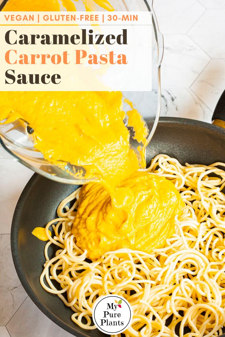 a pan filled with noodles and sauce being poured onto it