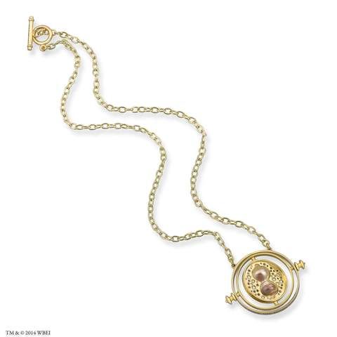 a gold necklace with a coin on it