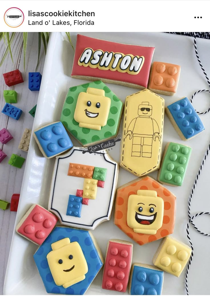 some lego themed cookies are on a plate