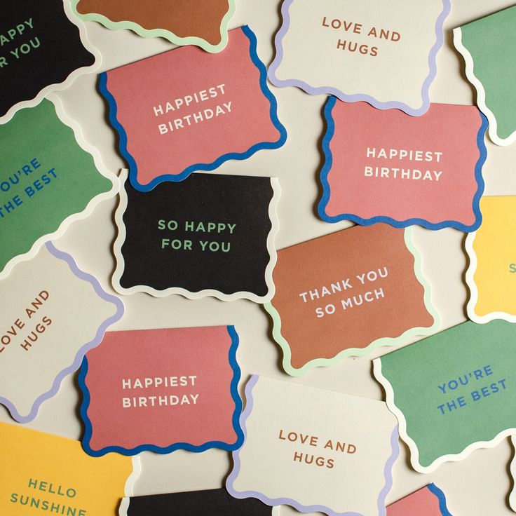 colorful birthday cards with the words happy and hugs written on them in different colors, shapes and sizes