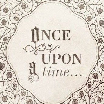 an ornate frame with the words once upon and time written in black ink on white paper