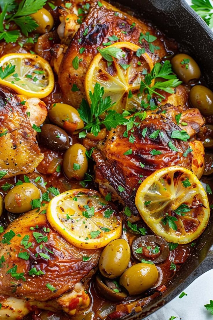 chicken with olives and lemon in a skillet