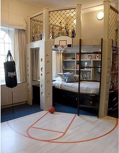 a basketball court in the middle of a room with bunk beds and ladders on it