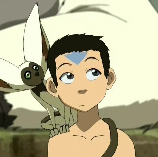 a young man is standing in front of a flying creature with his eyes wide open