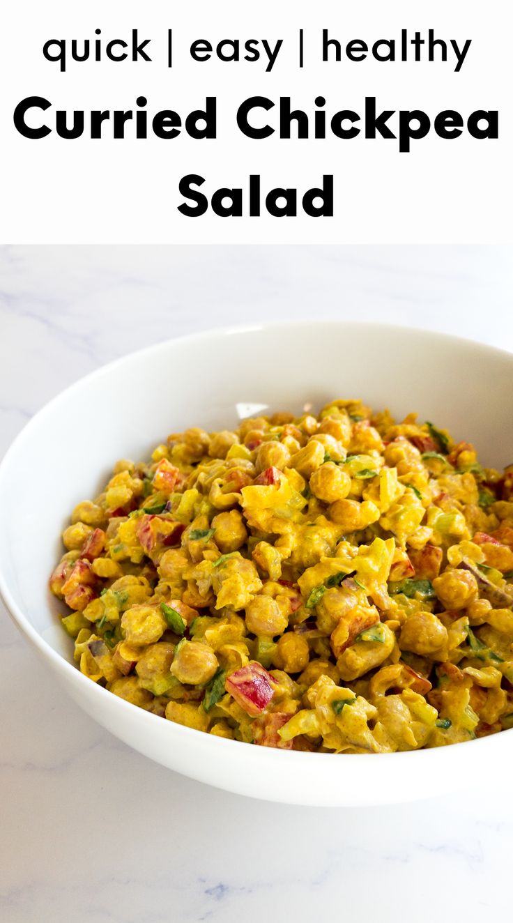 a white bowl filled with curryed chickpea salad