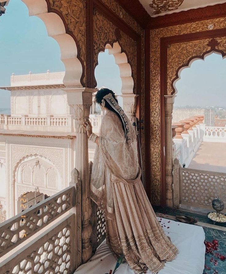 a woman standing on top of a balcony