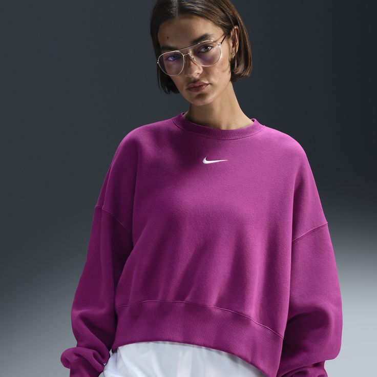 Grounded in style, comfort and versatility, meet our take on luxury loungewear. Our roomiest fit paired with exaggerated details (like the oversized pocket and taller ribbing) ensures this sweatshirt is anything but basic. All that's left to decide is whether to style it with the matching shorts or other pieces from your wardrobe. Nike Athleisure Tops With Ribbed Cuffs, Nike Workout Tops With Ribbed Cuffs, Nike Athleisure Sweatshirt For Spring, Nike Tops For Fall Loungewear, Pink Activewear With Ribbed Cuffs For Fall, Pink Crew Neck Activewear For Spring, Pink Ribbed Cuffs Activewear For Fall, Athleisure Tops With Ribbed Cuffs For Lounging, Nike Spring Sweats With Crew Neck