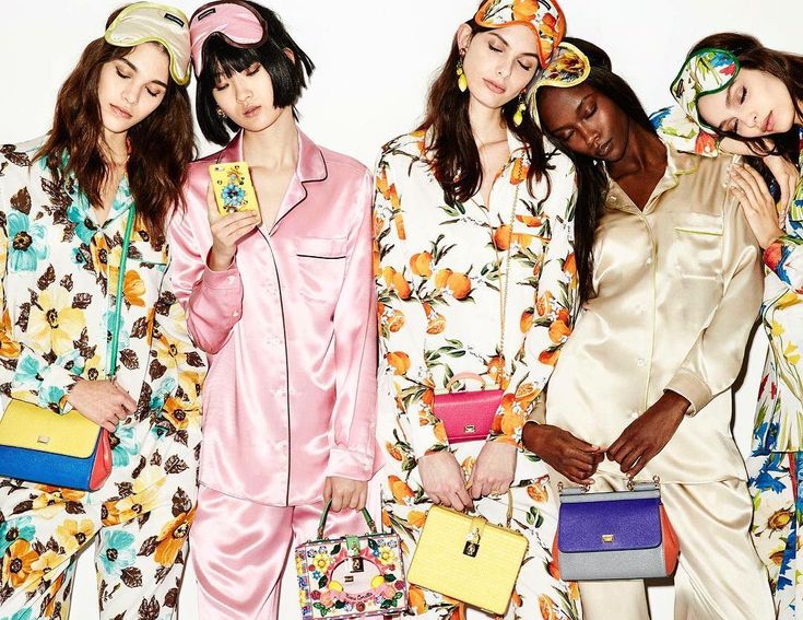 four models in matching pajamas and hats pose for the camera with their purses on