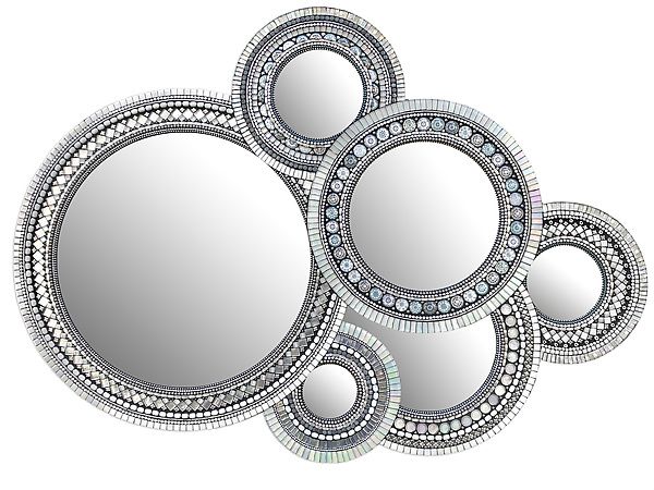 three circular mirrors are arranged in the shape of four circles, each with an intricate design