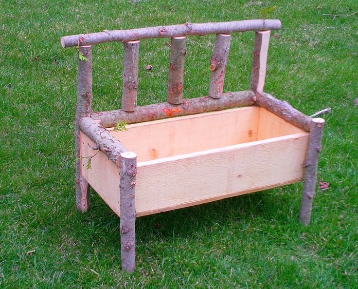 an old wooden bench sitting in the grass